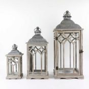 STORM LANTERNS, A GRADUATED SET OF 3.