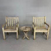 PAIR OF TEAK GARDEN ARMCHAIRS AND A LOW TABLE (3).
