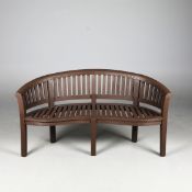 CURVED TEAK GARDEN BENCH.