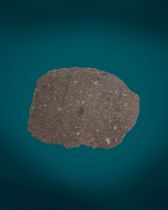 A LARGE SLICE OF A PRIMITIVE METEORITE