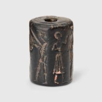 AKKADIAN SERPENTINE CYLINDER SEAL, ACQUIRED EARLY 20TH CENTURY