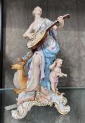 A late Meissen figure of a lady musician with deer and cherub 29cm (damage to deer's antlers, one