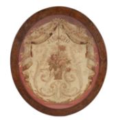 A 19th century Aubusson oval tapestry panel previously from a chair back framed and glazed 38cm x