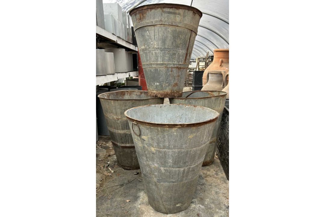 Large Transfer Vats Four galvanised large vats or planters The planters of waisted ...