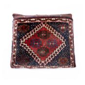 A Luri bag with a cushion filling, southwest Iran; wool pile and an elaborate brocaded back. Late