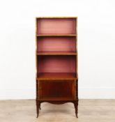 In the Regency Style Waterfall Bookcase mahogany, with crossbanded details three graduated shelves