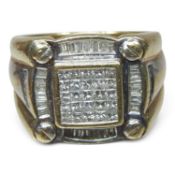 A 9 carat gold gentleman's pave set diamond set ring, of square shape, with a diamond surround, 12.