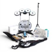 The Beatles Rock Band for Nintendo Wii accessories part set, together with a Wii console,