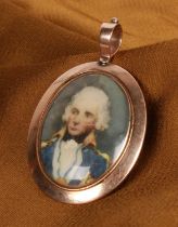 An antique yellow metal double portrait miniature locket pendant, each side containing a portrait of