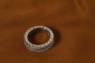 An 18 carat white gold baguette cut diamond full hoop eternity ring, approximately 3.0 carat