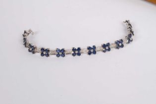 An 18 carat white gold sapphire and diamond bracelet, approximately 6.0 carats of sapphires in