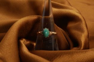 An 18 carat yellow gold turquoise solitaire ring, size M/N, 2.9g