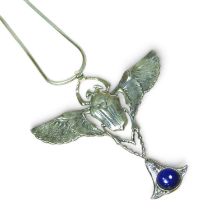 A modern sterling silver Egyptian revival, enamel and lapis pendant, in the form of a scarab beetle,