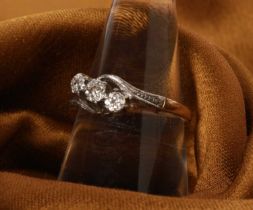A 9 carat yellow gold and platinum illusion set three stone diamond ring, size P, 2.8g