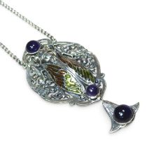 An Egyptian style sterling silver and cabochon set scarab pendant, 10cm high, on a silver chain