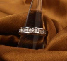 An 18 carat white gold diamond channel set ring, approximately 1.5 carats total Overall condition is