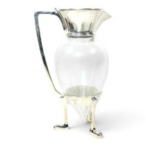 After Christopher Dresser, a glass claret jug, with plated mounts, on crows feet, 25cm high