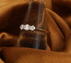 An 18 carat yellow gold diamond three stone ring, size O/P, 2.0g
