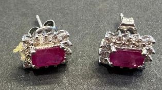 Pair of earrings with central rectangular stones, appear to be rubies, marked 18ct White Gold