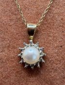 Ladies Gold necklace with pearl and gold pendant marked as 10k (1.8g total) very fine link chain