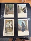 Three large albums of postcards
