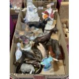 A box of ceramic and resinous figures