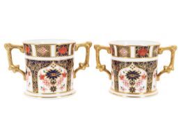PAIR OF ROYAL CROWN DERBY TWIN HANDLED LOVING CUPS, CIRCA 1981 AND 1992