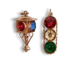 Two gold and coloured paste charms, one a ‘traffic light’, 3cm h, 7.5g Condition Report: Slight