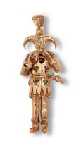 A ruby, sapphire, emerald and amethyst jester pendant, in 9ct gold and fully articulated, 7.5cm h,