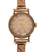A 9ct gold lady’s wristwatch, 2.2cm diam, London 1950, on a plated bracelet Condition Report: