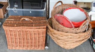 A set of three wicker baskets 53cm dia, two others and a Victorian enamel bread bin and cover  (