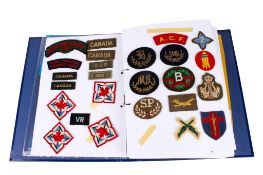A collection of 20th century Canadian army military cloth badges.