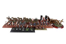 A collection of modern die cast soldier figurine groups.