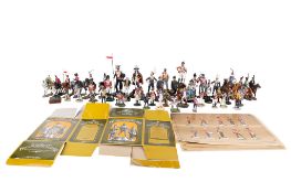 A collection of assorted painted die cast metal figures of soldiers.