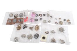 A group of approximately 41 assorted military cap badges, some German, etc.