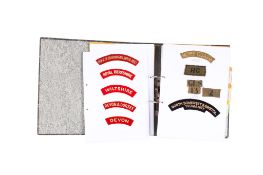 A collection of military cloth badges.