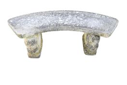 A composite stone garden bench.