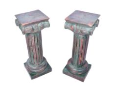 A pair of carved wooden stands.