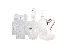 Seven contemporary glass decanters.