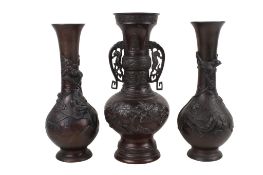 A pair of Japanese bronze vases and another. All decorated with birds in foliage, max.