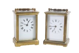 Two brass five-glass carriage clocks. Having white enamel dials with Roman numerals.