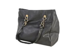 A vintage Elizabeth Arden oversized black shoulder and travel bag.