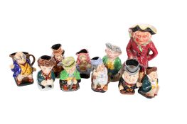 A collection of Toby and mostly Dickens characters jugs.