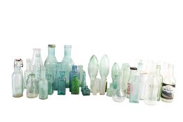 A collection of assorted glass storage bottles, some of local interest.