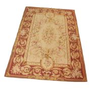 An Aubusson style tapestry on a cream ground.