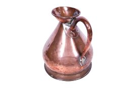 A large copper jug. Having a hammered exterior, on a circular base, H32cm.