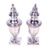 A pair of silverplated shakers.