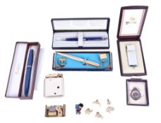 A collection of assorted pens, cigarette lighters, and other lighters.