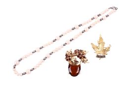 Three pieces of jewellery.