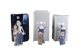 Three boxed Lladro porcelain figurines.